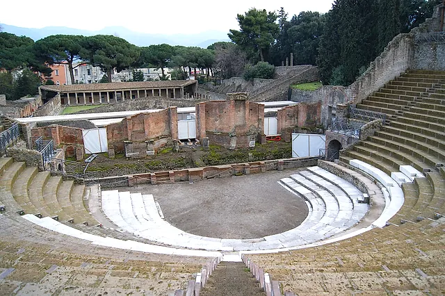 The Large Theatre of Pompeii seen from the upper tiers, with the stage building and a portico behind