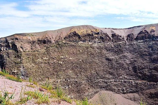 The layered inner wall of the Vesuvius crater with the rim above