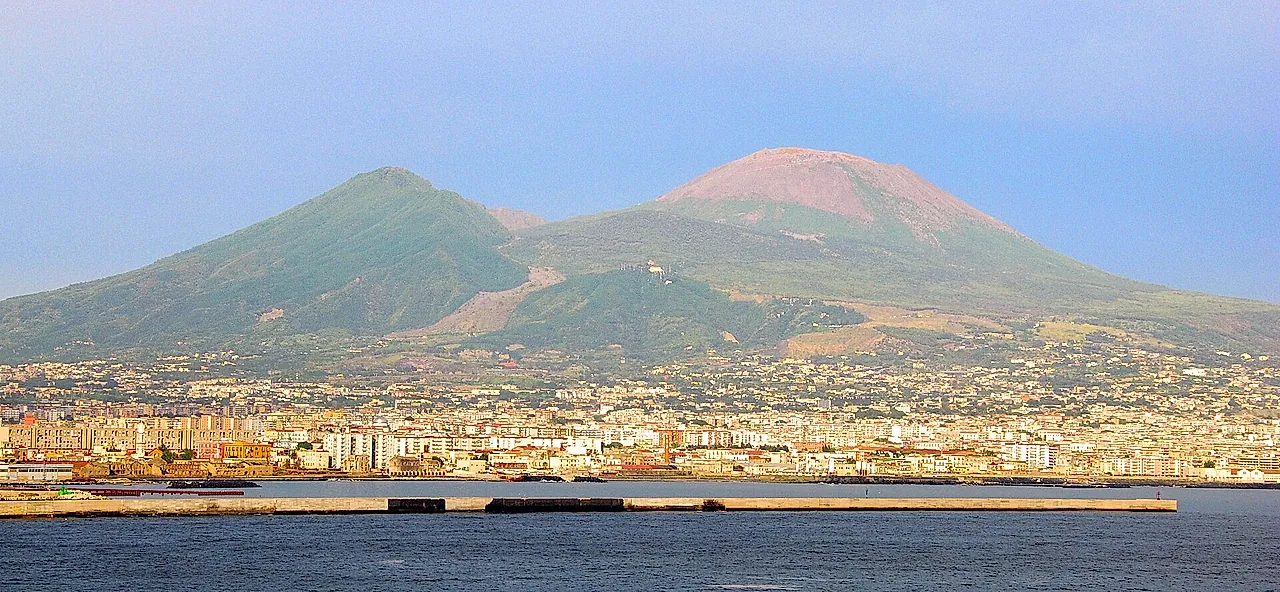 Mount Vesuvius and Monte Somma rising above the city of Naples, seen from the sea