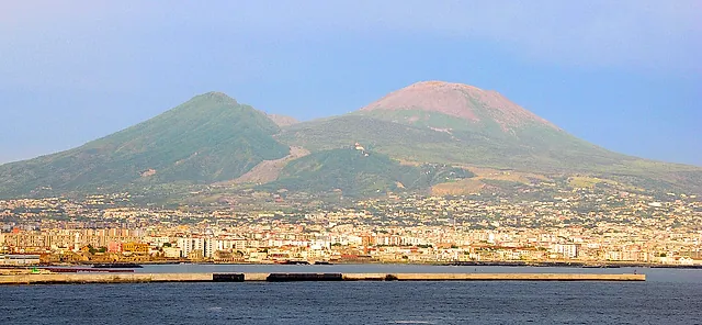 Mount Vesuvius and Monte Somma rising above the city of Naples, seen from the sea